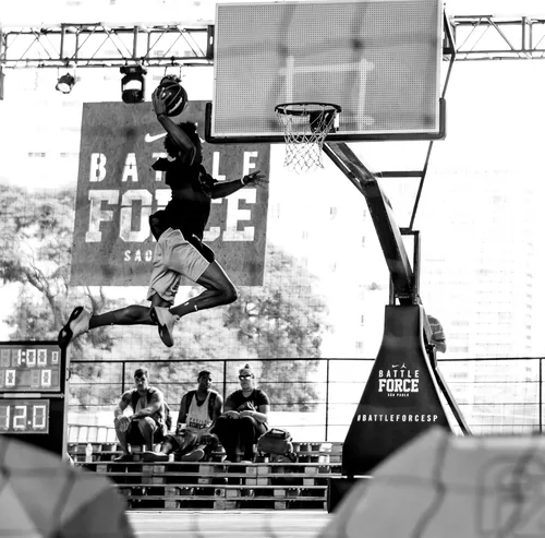 man dunking a basketball